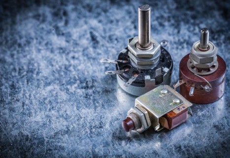 Electric toggles on metallic surface top view electricity concept