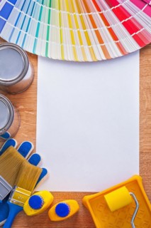 Group of colour tools and Pantone colour palette guide on sheet of paper construction concept