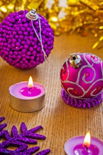 Christmas composition of baubles and candles
