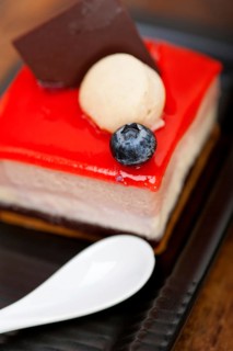 Fresh strawberry yogurt mousse with macaroon and blueberry on top