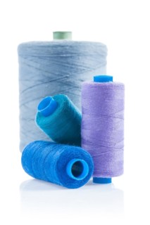 Four insulated sewing bobbins
