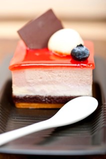 Fresh strawberry yogurt mousse with macaroon and blueberry on top