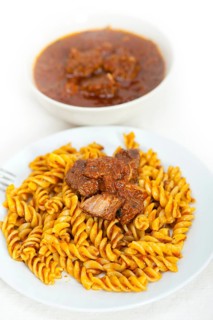 Fusilli pasta al dente with neapolitan style ragu meat sauce very different from bolognese style