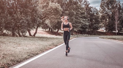 Sports girl jogging in the park. The concept of a healthy lifestyle. Sports Equipment. Fitness style advertisement. mixed media