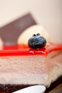Fresh strawberry yogurt mousse with macaroon and blueberry on top