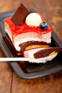 Fresh strawberry yogurt mousse with macaroon and blueberry on top