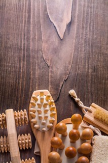 Classic wooden massagers on vintage wooden board with copy surface