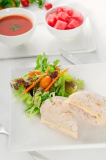 Tuna fish and cheese sandwich with fresh mixed salad