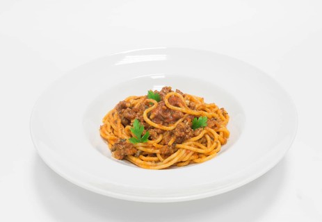 Gourmet pasta with minced meat and tomato sauce. Top view. White background. Healthy eating concept.