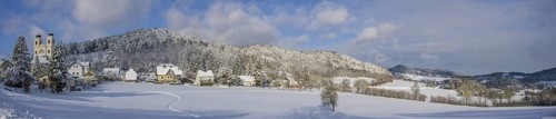 Winter panorama with view to Pankraziburg and church on