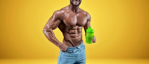 Isolated no name professional athlete on a yellow background. Bodybuilding concept. Panorama. Advertising of a gym and sports nutrition.