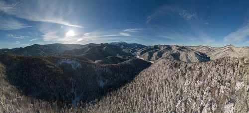 Aerial view of the Schneeberg over the snow-covered landscape near the chapel of the seven holy fathers