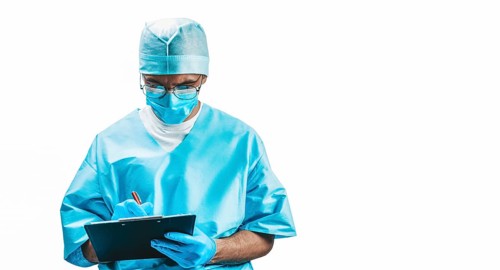 Portrait of a doctor who fills out an insurance policy. Medicine concept.