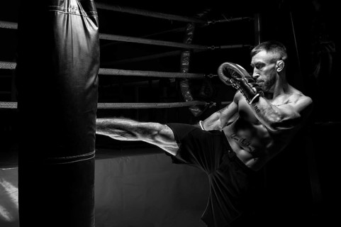 Kickboxer kicks the bag. Training a professional athlete. The concept of mma