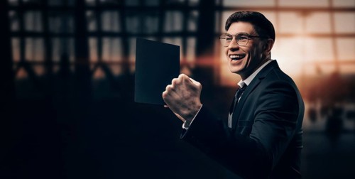 Portrait of a man in a business suit. He is standing at the airport with his hands up. VIP transportation. Private airlines. Charter flights.
