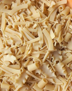 Mixed pasta of various shapes background
