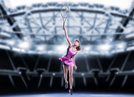 Portrait of a tennis player in a pink dress against the background of a sports arena.