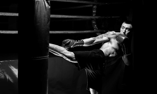 Kickboxer kicks the bag. Training a professional athlete. The concept of mma