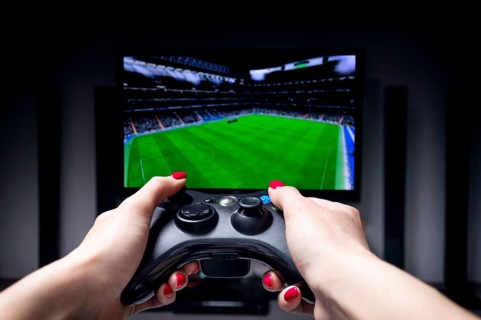 The image of the joystick on the background of the TV screen. ESports concept.