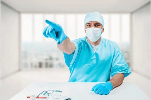 The doctor in the clinic points to an information board. Medicine concept.