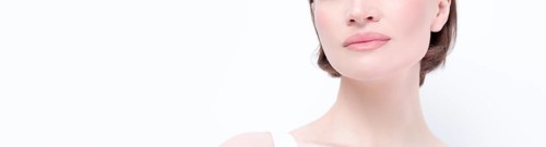 Portrait of a beautiful girl with provocative makeup. White background. Beauty concept. High quality