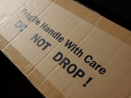 Corrugated cardboard with fragile label