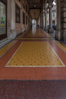 Floor mosaic in an arcade on Via XX Settembre