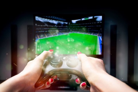 The image of the joystick on the background of the TV screen. ESports concept.