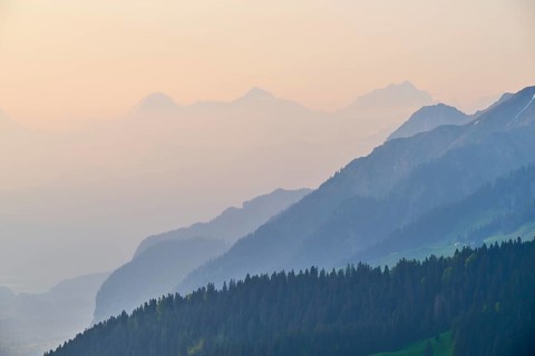 Sunrise over a misty mountain landscape with Eiger
