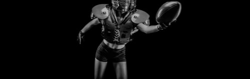 NO name portrait of a woman in shoulders pads. American football. Sports concept.