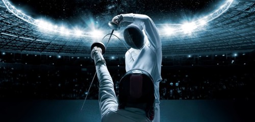 Portrait of two fencers against the backdrop of a sports arena. The concept of fencing. Duel.