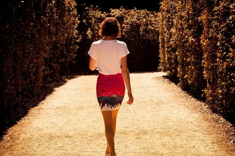 Portrait of a charming woman walking in the Boboli Gardens. Back view. Tourism and travel concept.
