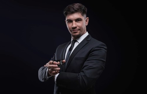 Portrait of a stylish man in a suit with a cigar. Business concept.