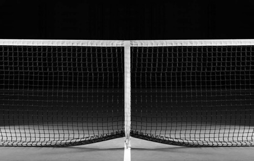 Image of a tennis court with a stretched net. Sports concept.