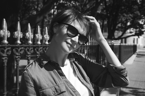 Portrait of a stylish woman in sunglasses. Happiness