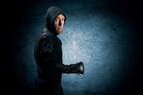 Mixed martial artist goes to battle in a sweatshirt. Concept of mma