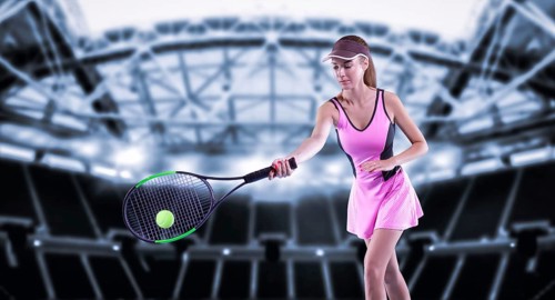 Portrait of a tennis player in a pink dress against the background of a sports arena.