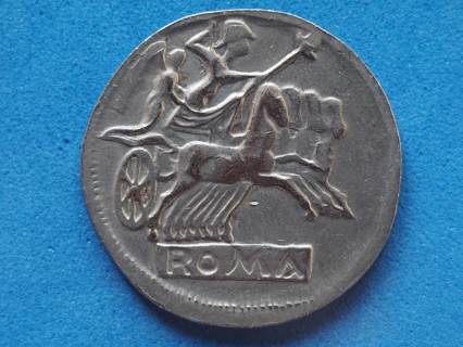 Ancient roman coin with horses and biga