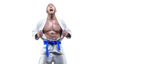 Professional athlete in a kimono screams emotionally. The concept of karate and judo competitions.