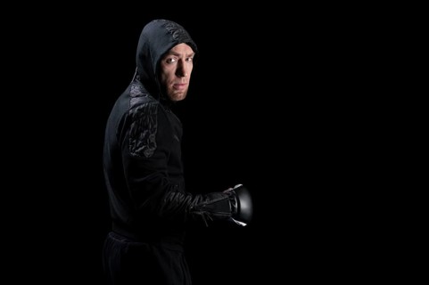 Mixed martial artist goes to battle in a sweatshirt. Concept of mma