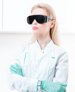Portrait of a girl in black glasses for laser hair removal. Concept of cosmetology