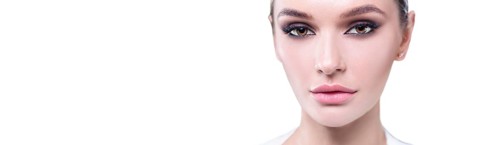 Portrait of a female young face with perfect makeup. The concept of plastic surgery