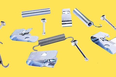 Parking brake springs and clamps repair kit on yellow isolated background
