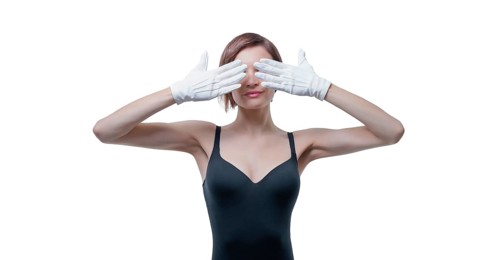 Beautiful young woman in white gloves covered her eyes with her hands