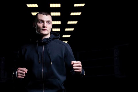 Young kickboxer posing in the studio. The concept of martial arts