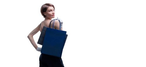 Beautiful young woman in white gloves threw a black craft bag over her shoulder. Shopaholics concept. Spenting. Gifts for the holidays. Black Friday. Shopping centers