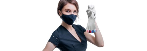 Portrait of an elegant beautiful girl wearing a protective mask with a set of nail palette in hand. White background. Advertising banner for beauty salons during Covid-19. Pandemic. Modern trends.