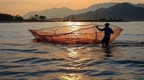 Fisherman in silhouette against the sunset