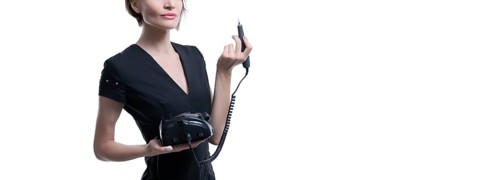 Portrait of a charming woman with a manicure device. Manicure and pedicure concept. Nails artist