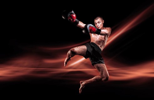 Flying mma fighter. Kickboxing concept. Knee strikes. High quality